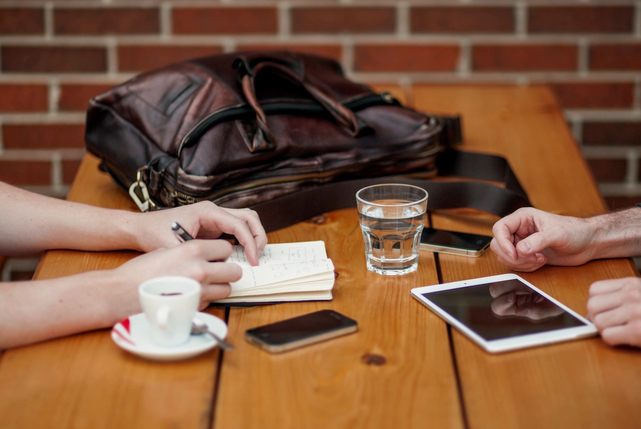 Business meeting at wooden table